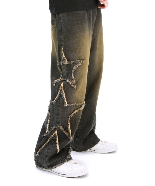 Black jeams with vintage wash and star distressing.
